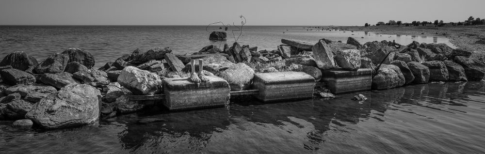 concrete feet by the sea